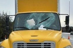 Ice flies from vehicle roof, crashes through truck’s windshield