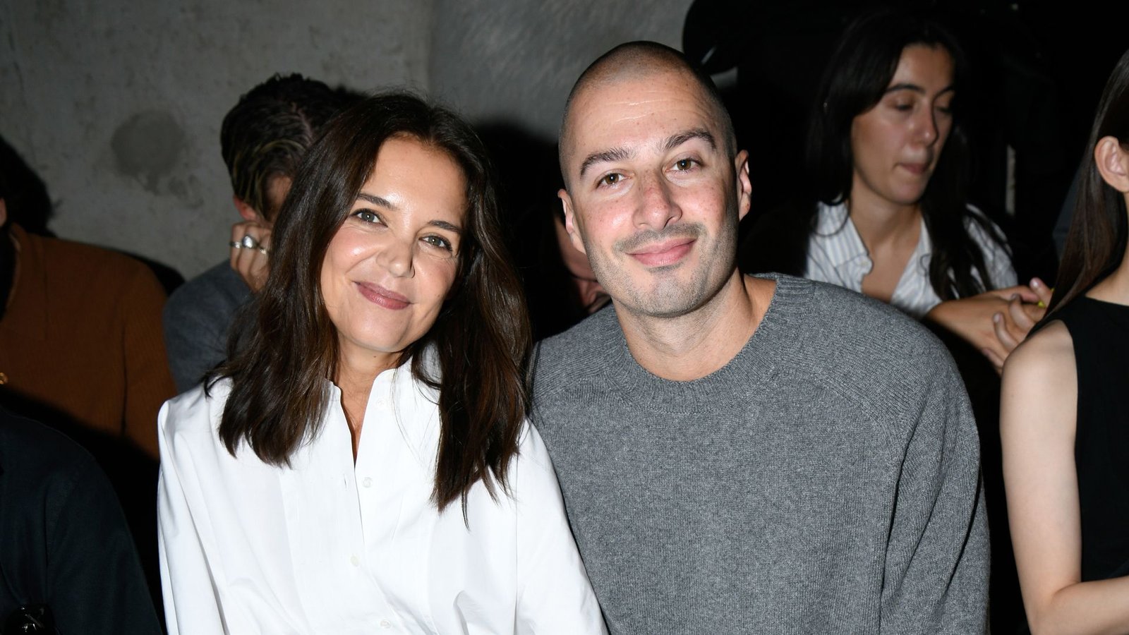Katie Holmes and Jason Bard Yarmosky look cozy together while front row at Paris Fashion Week